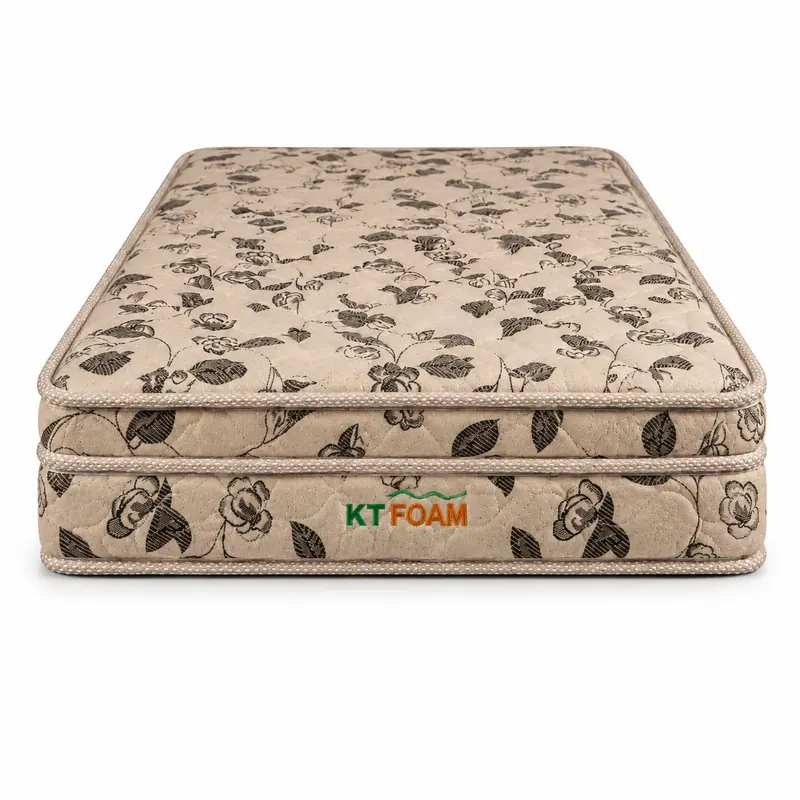 Beige floral-print foam mattress shown against a white background