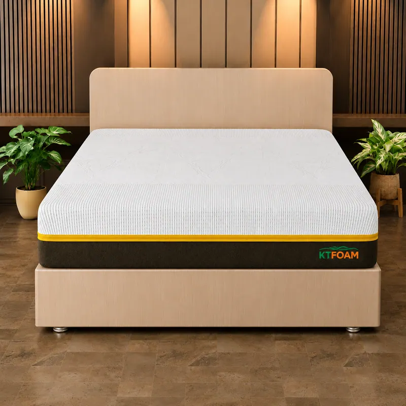 White latex mattress with a yellow trim on an upholstered double bed