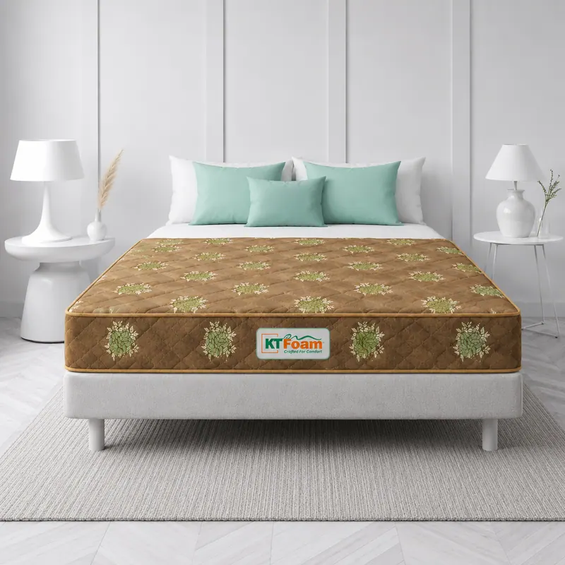 Brown floral-print 7 inch mattress on a white bed with mint cushions