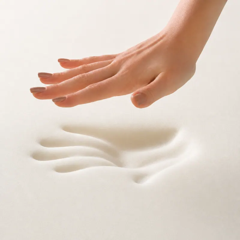 A hand lifting away from foam, leaving an imprint that slowly fades