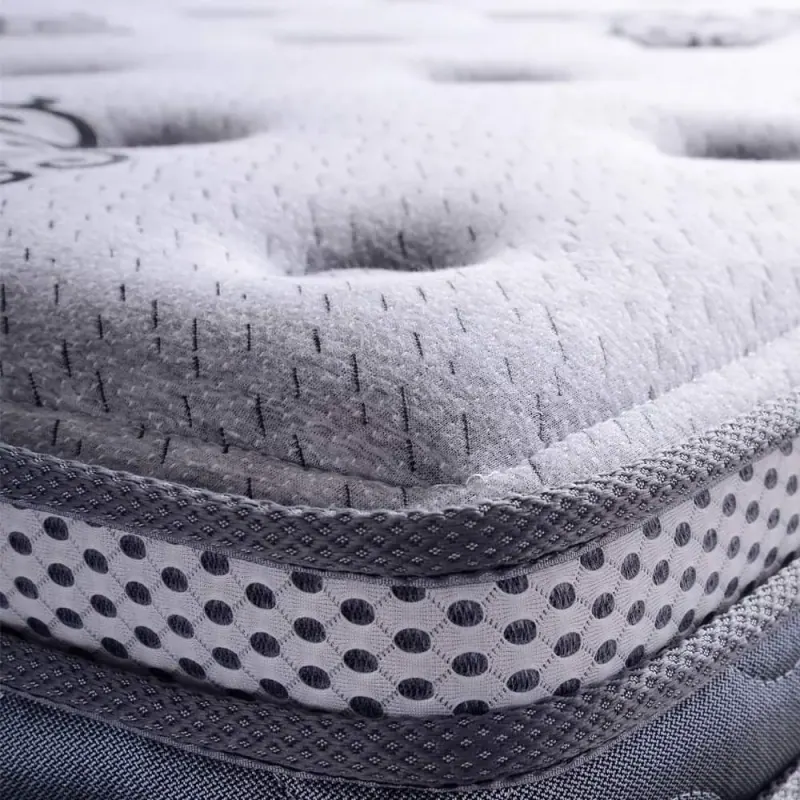 Close view of quilted mattress fabric and the breathable mesh border